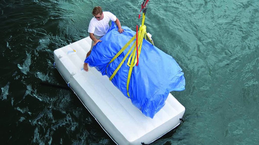 Man on inflatable yacht work platform