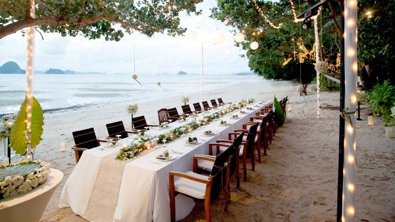 Dining table set up on a beach