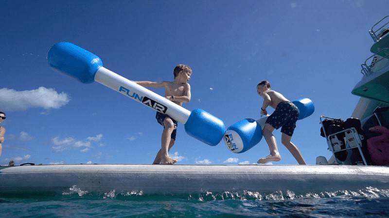 2 Boys playing on Water Joust