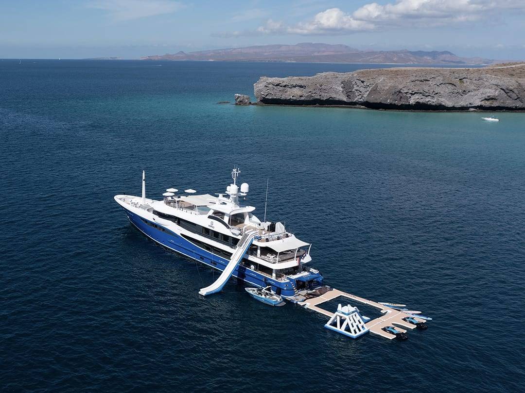 Motor Yacht Nomad with her Custom FunAir inflatable Sea Pool Yacht Slide Jet Ski Dock and Playground