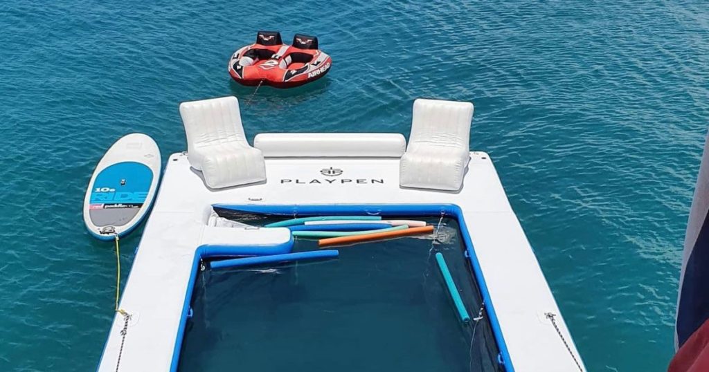 A Beach Club Sea Pool with Wave Chairs attached to it and superyacht toys tethering from the pool