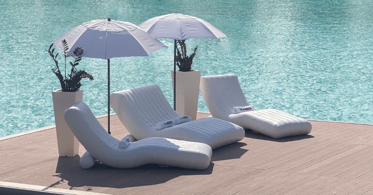 Best Beach Furniture for Your Yacht including FunAir Double Wave Lounger on a jetty with blue water in the background