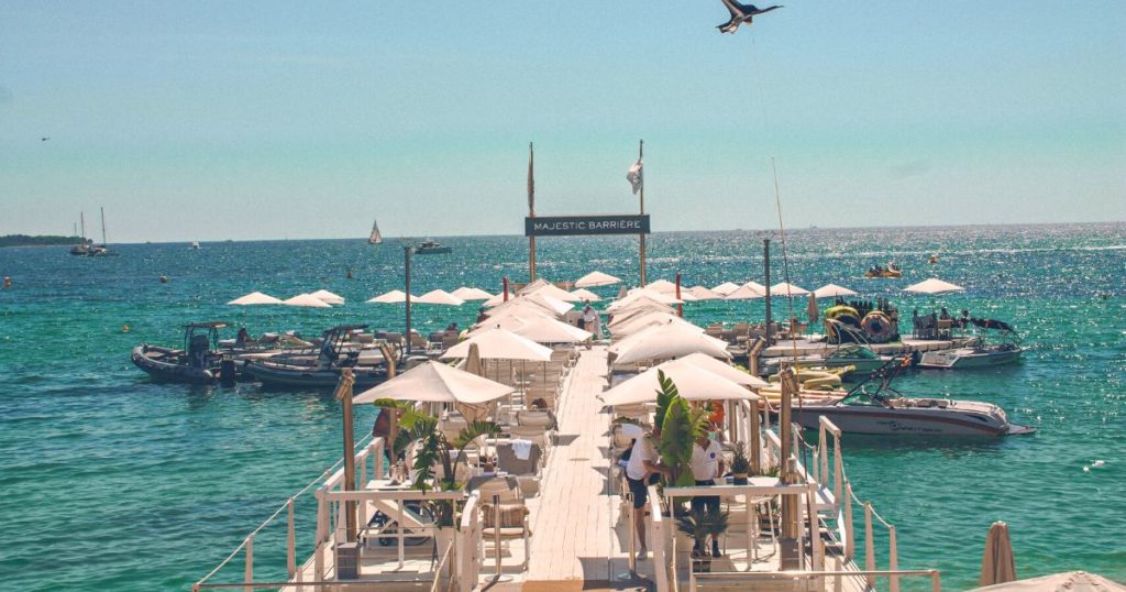 Luxury beach bar in Cannes with sun loungers for superyacht crew and guests