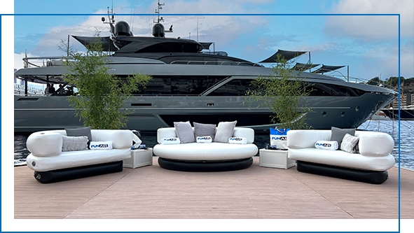 FunAir Club Chaise and Chairs in front of a charter superyacht