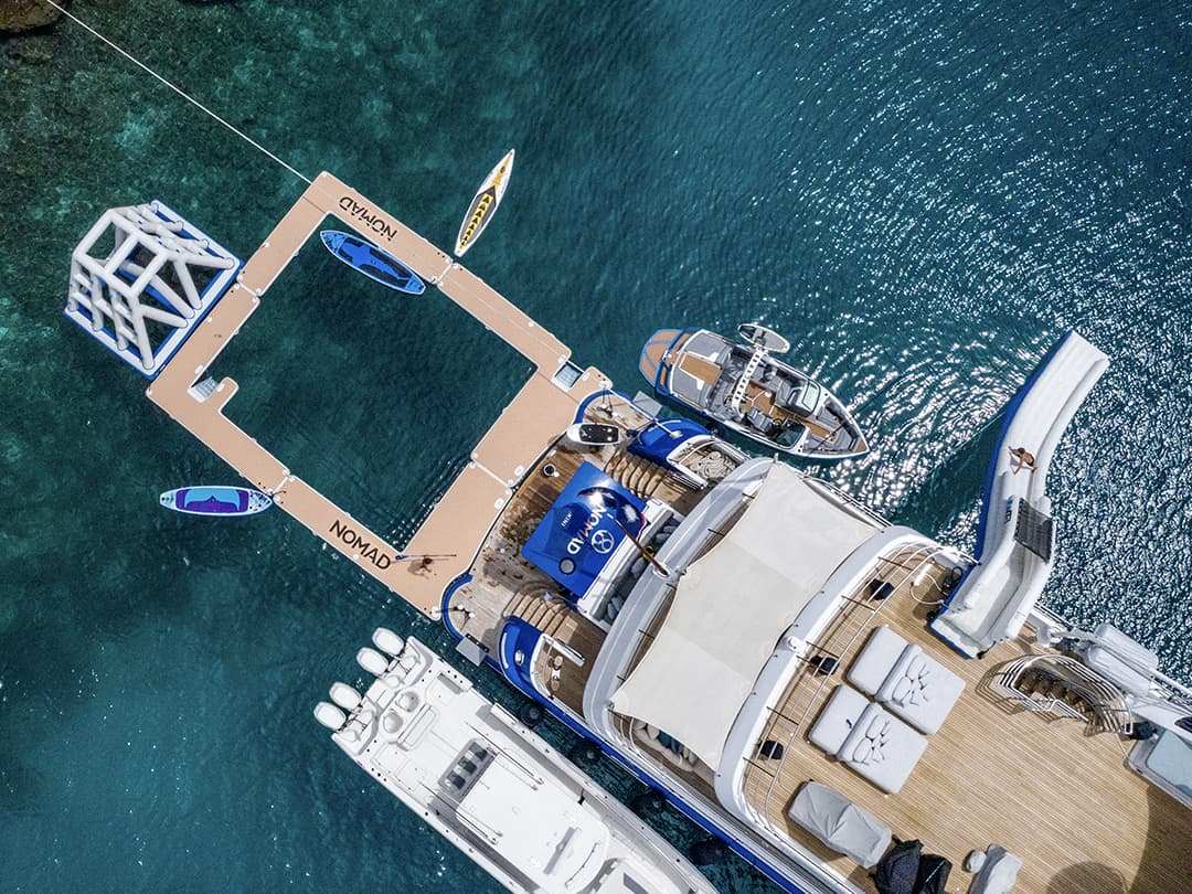 Drone view of the Custom Sea Pool, Yacht Slide and Floating Playground belonging to MY Nomad