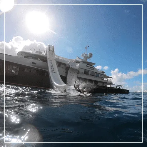 Charter-guest-sliding-down-a-superyacht-slide