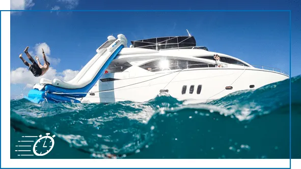 Charter-superyacht-guest-using-a-FunSize-Yacht-Slide-on-a-yacht