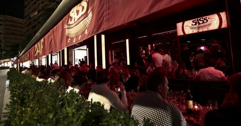 Grand Prix fans celebrities and superyacht guests in Sass Cafe in Monaco