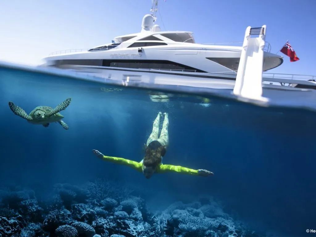 charter-guest-underwater-after-using-a-custom-yacht-slide