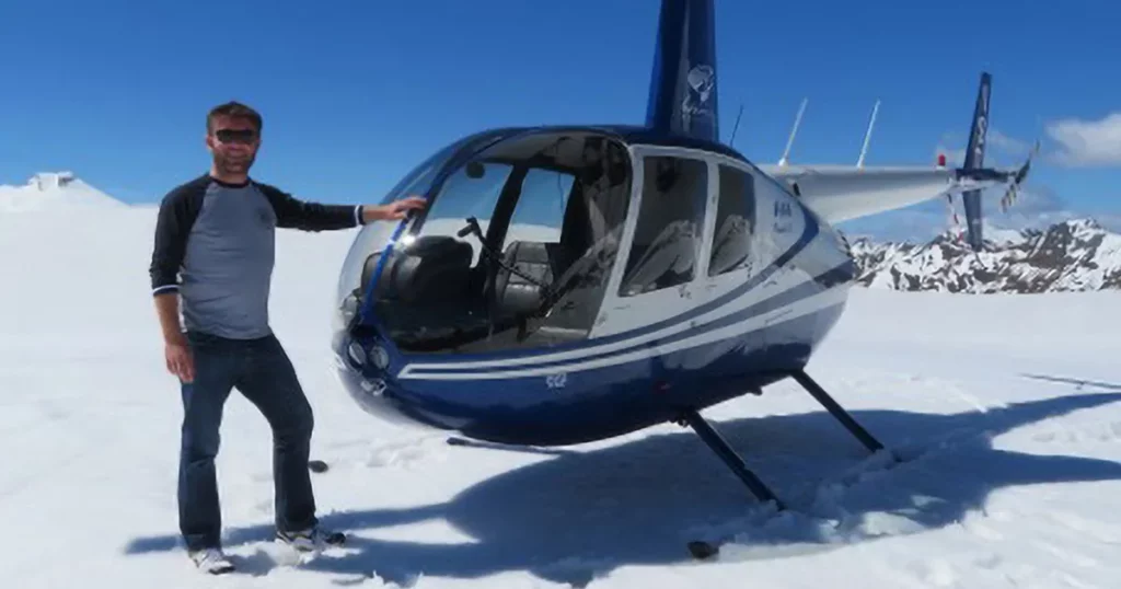 FunAir Ambassador Andy Haffenden in front of a helicopter