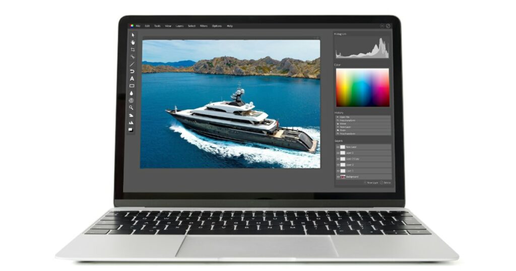 FunAir Editing superyacht photos on a laptop