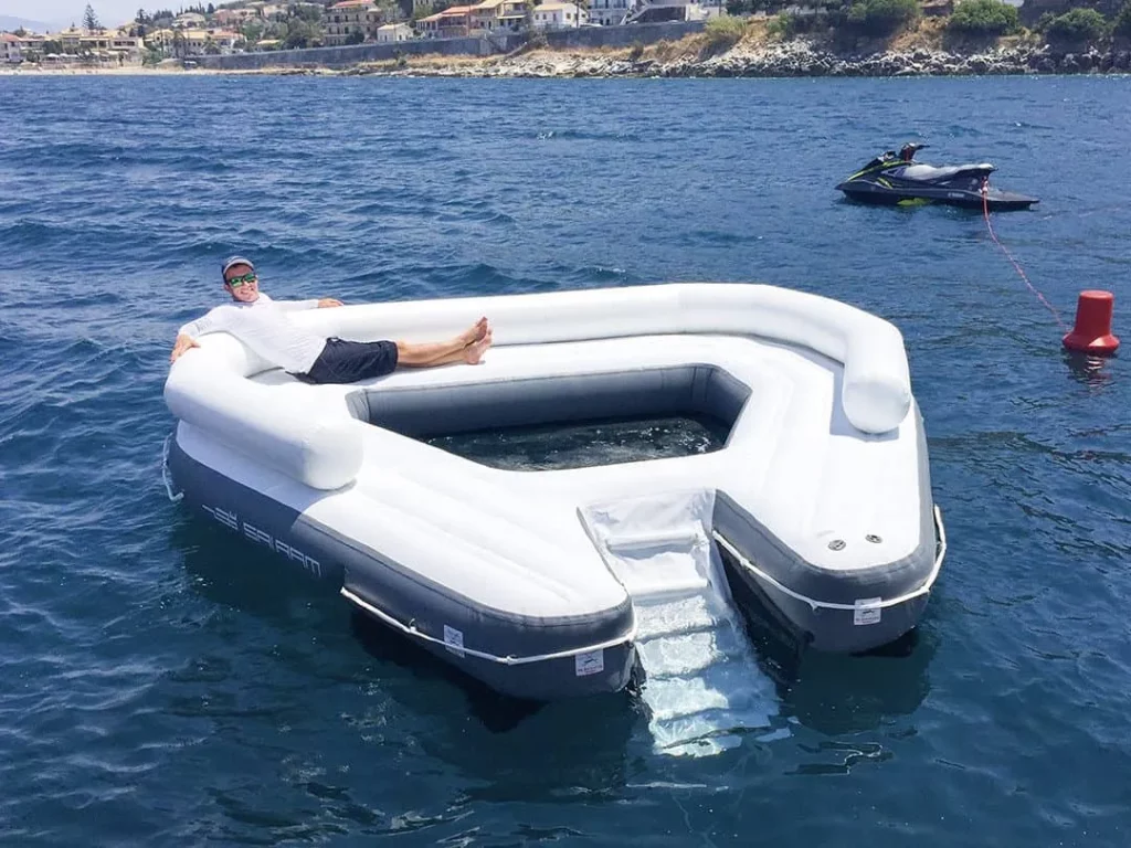 Charter guest relaxing on a FunAir Floating Oasis