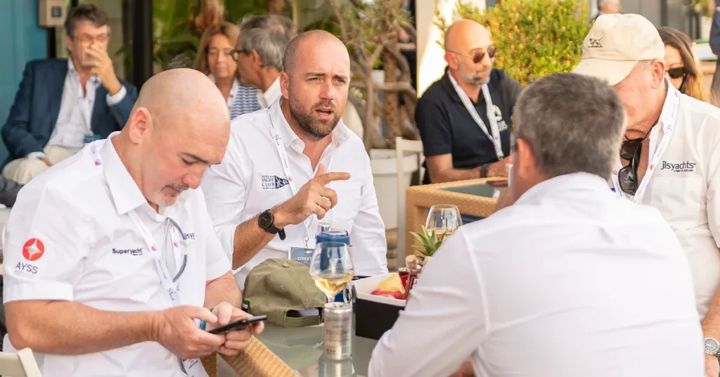 Members of superyacht crew networking at the Monaco Yacht Show