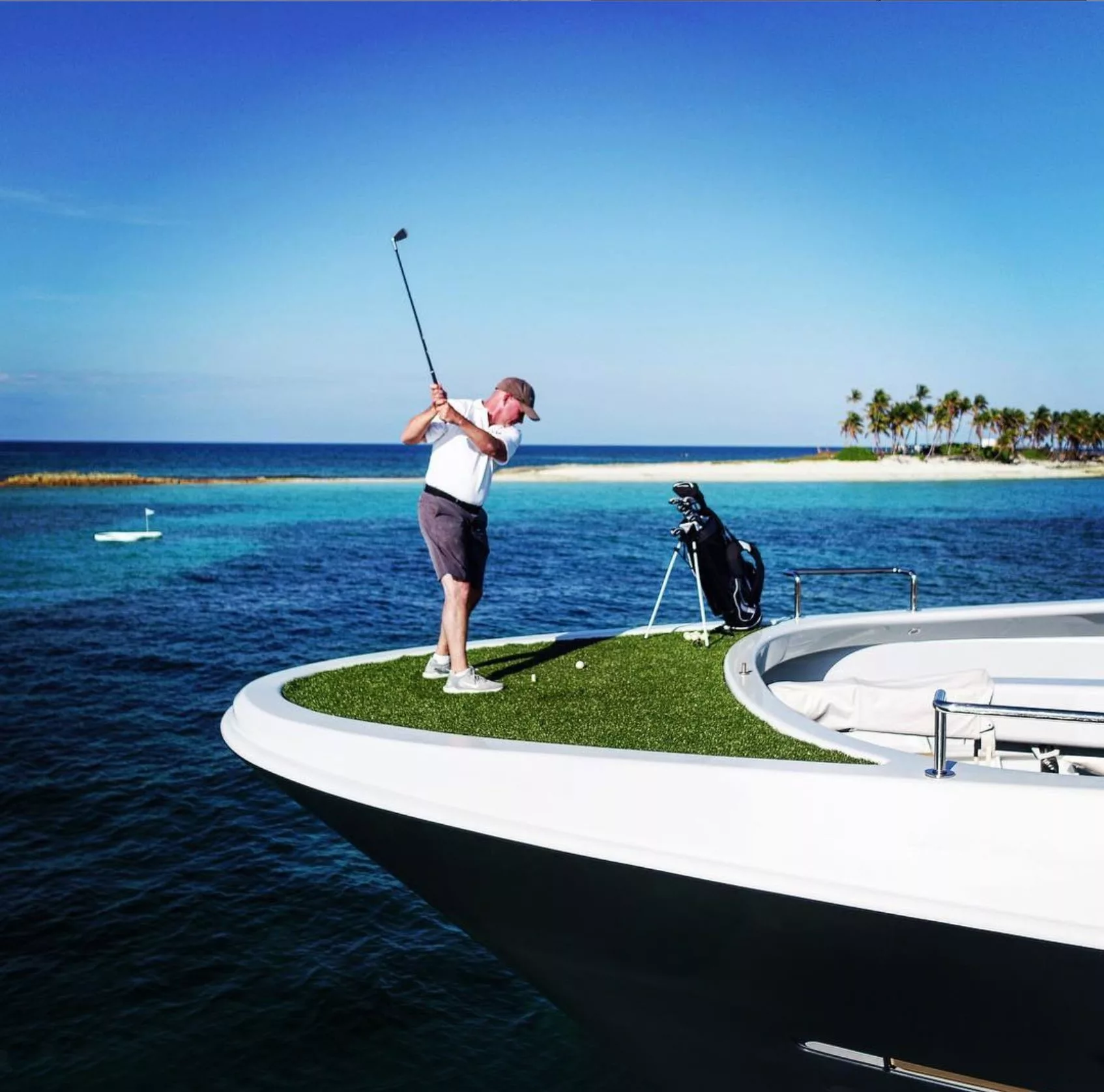 Charter guest from MY Gene Machine playing Yacht Golf from the bow