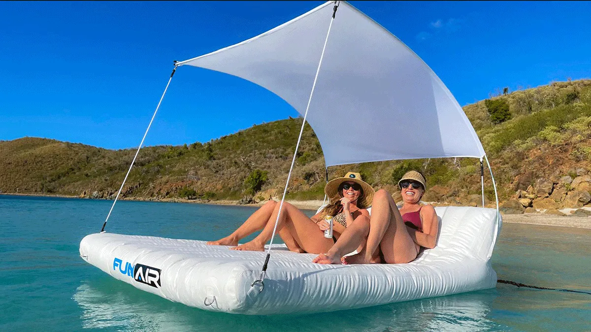 Charter guests from a charter superyacht relaxing on a Floating Shaded Lounger