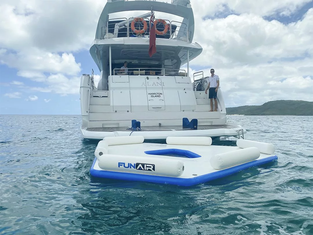 Charter yacht Alani crew member with FunAir Splash Island
