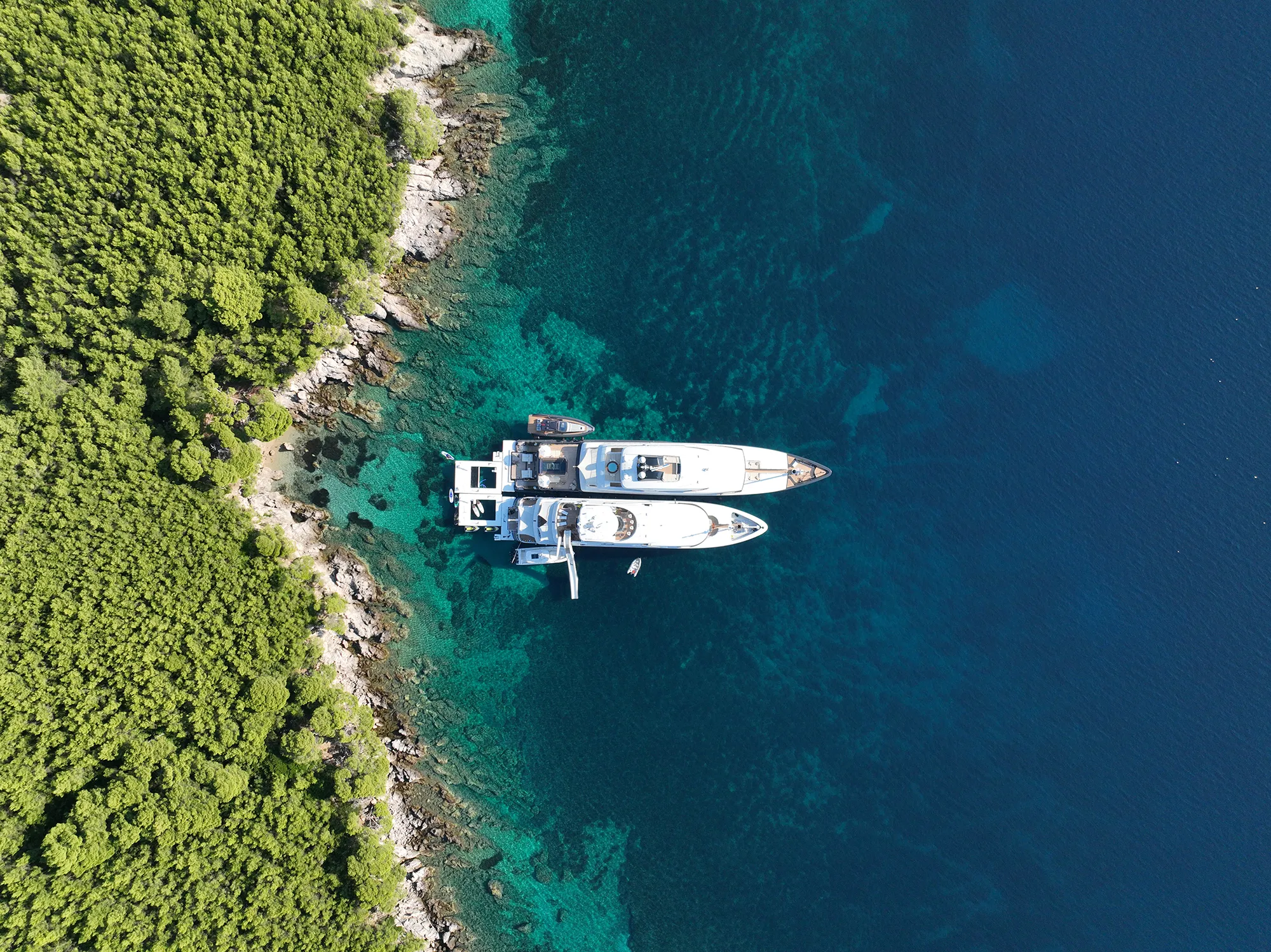 Drone view of the Sea Pools and Yacht Slide on MY Loon 221 and Loon 180 in tandem in Croatia