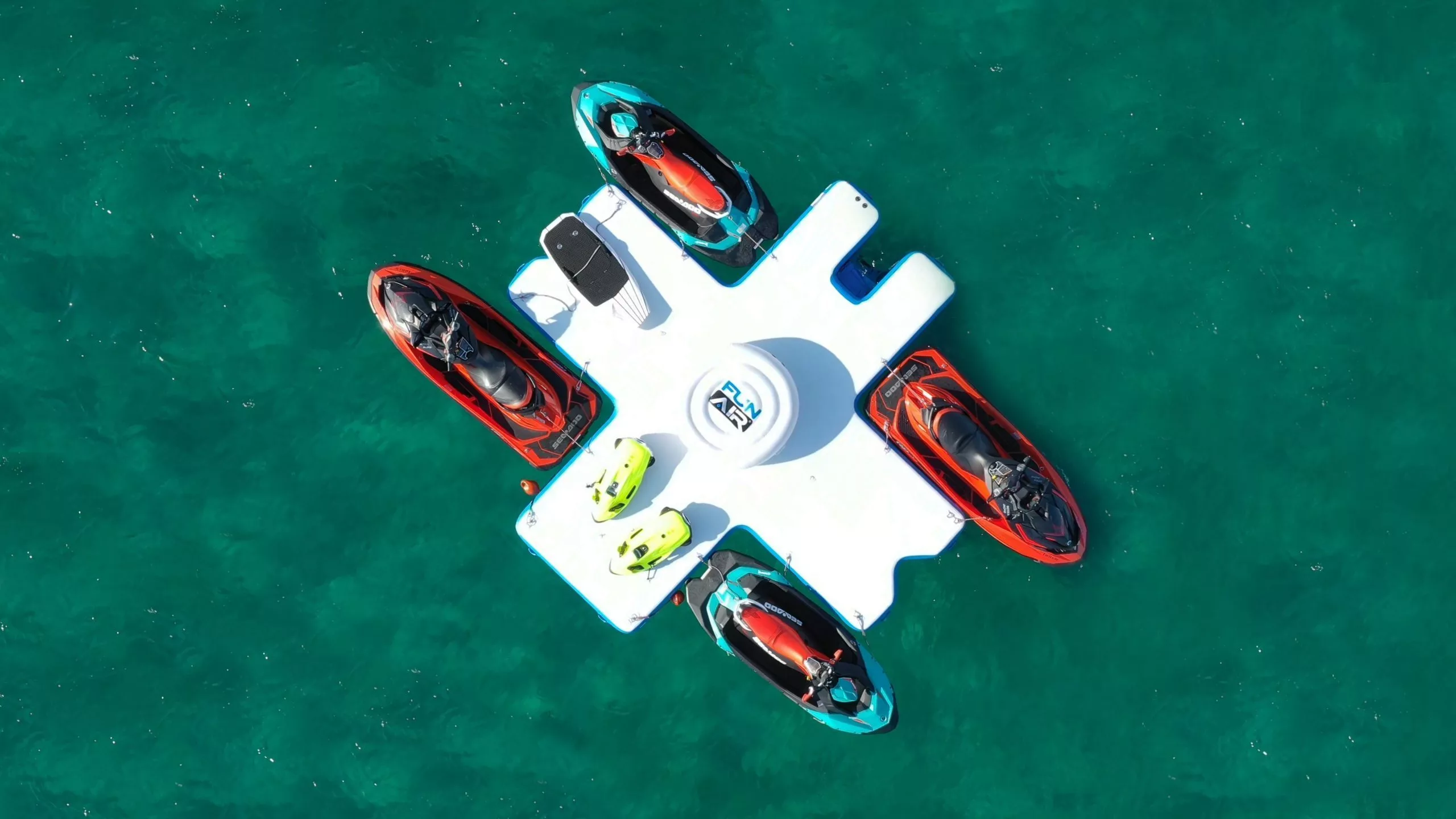 Drone view of the Toy Island from Motor Yacht Latitude with Jet Skis SeaBobs and EFoils