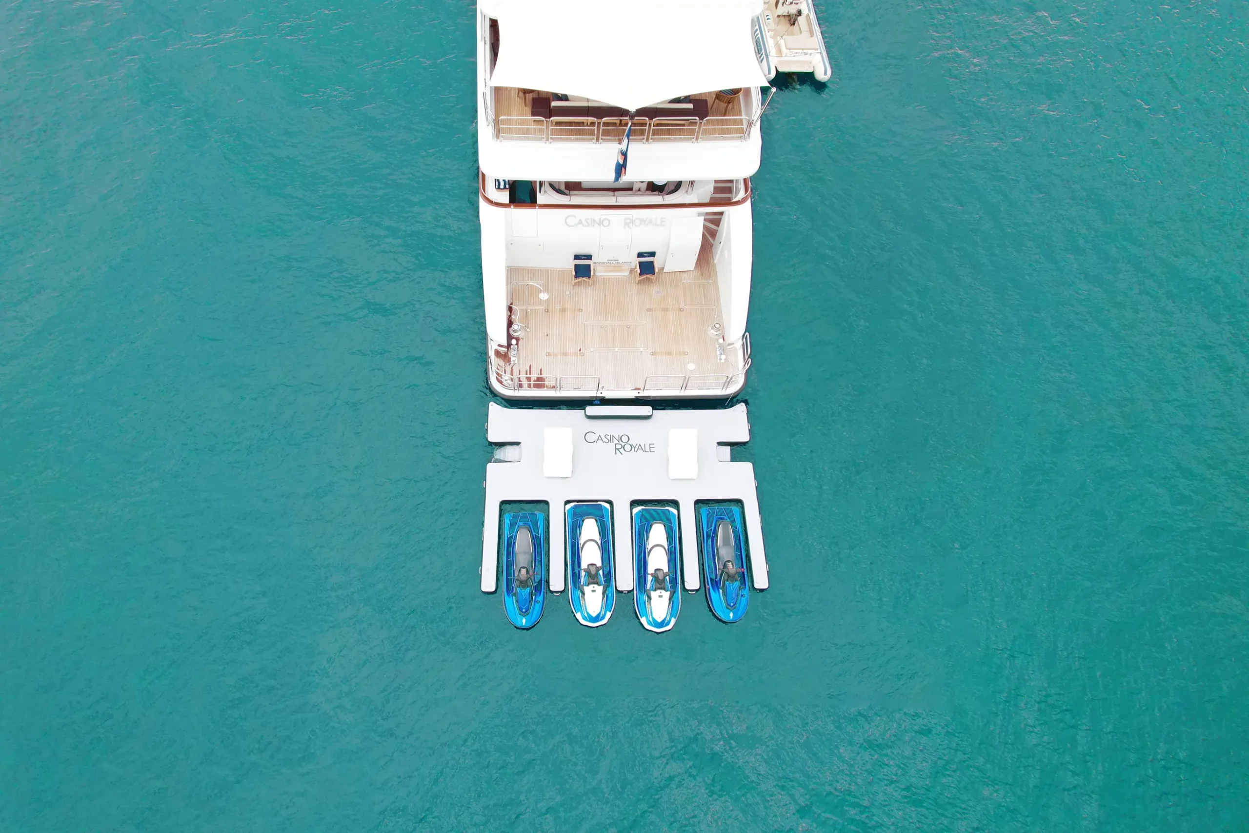 Jet Ski Dock Beach Loungers MY Casino Royale overhead view in azure water