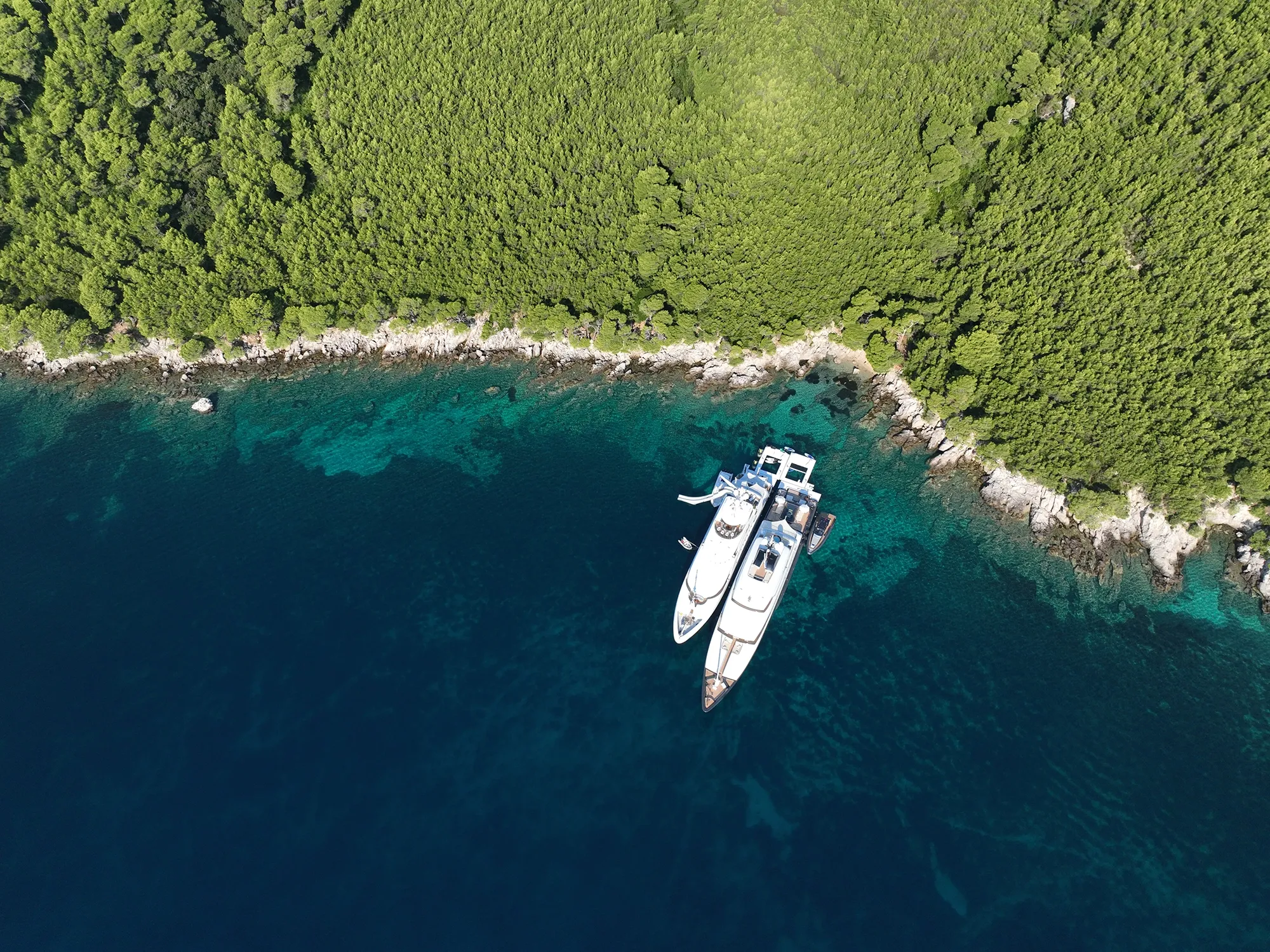 Sea Pool Yacht Slide Loungers MY Loon 221 and Loon 180 in tandem in Croatia drone view of anchorage with yachts at an angle