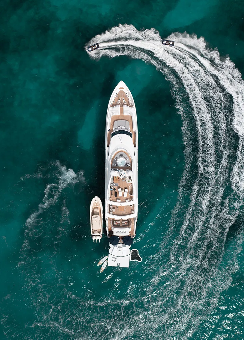 Swim Platform Extension Yacht Golf on Motor Yacht Acacia overhead drone shot with jet skis in ocean