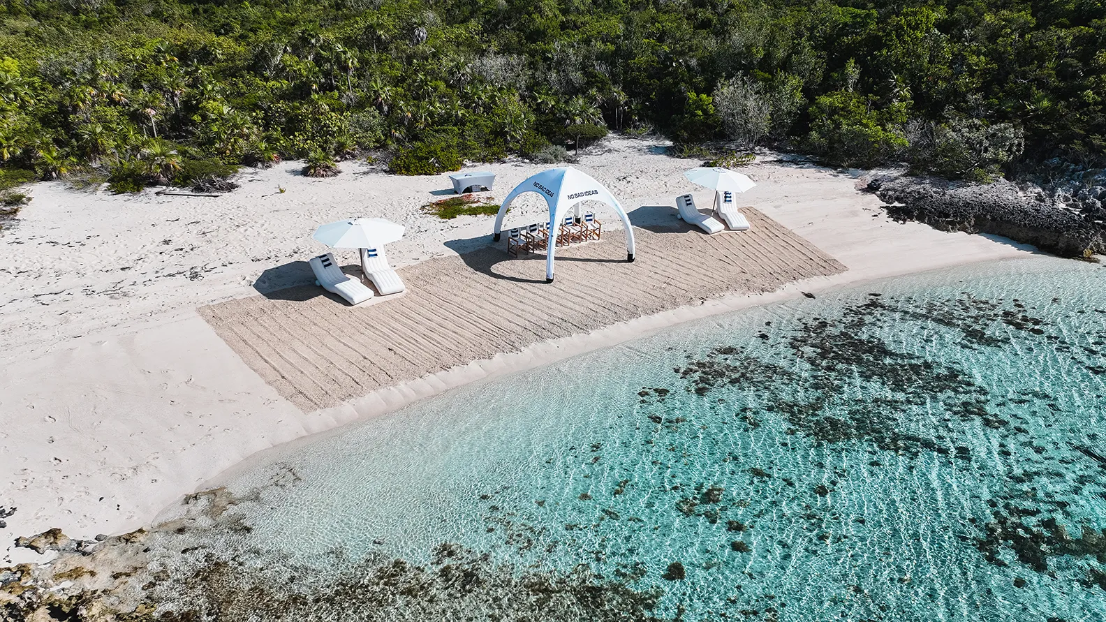 Wave Loungers from Motor Yacht No Bad Ideas drone shot of beach set up