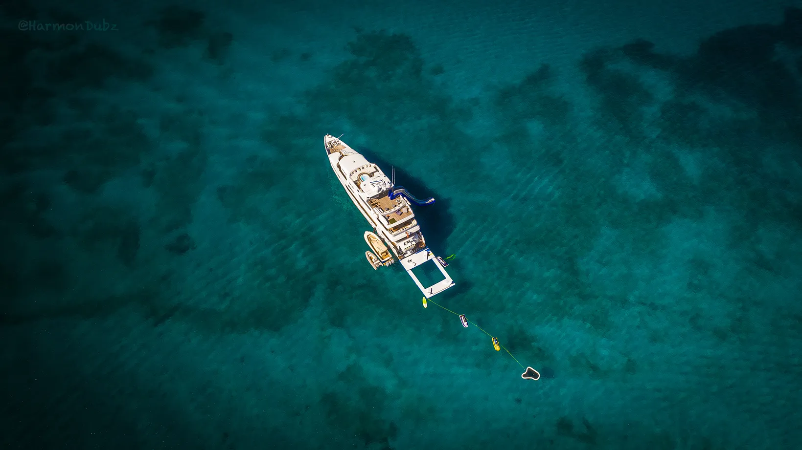 Yacht Golf and Sea Pool charter yacht MY Milestone view from drone in blue ocean