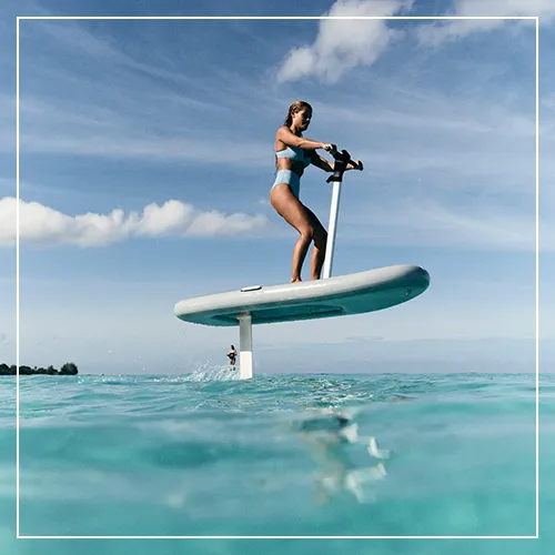 Charter guest from a luxury superyacht riding the buoyant Fliteboard