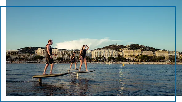 Guests from a superyacht riding Fliteboards on vacation