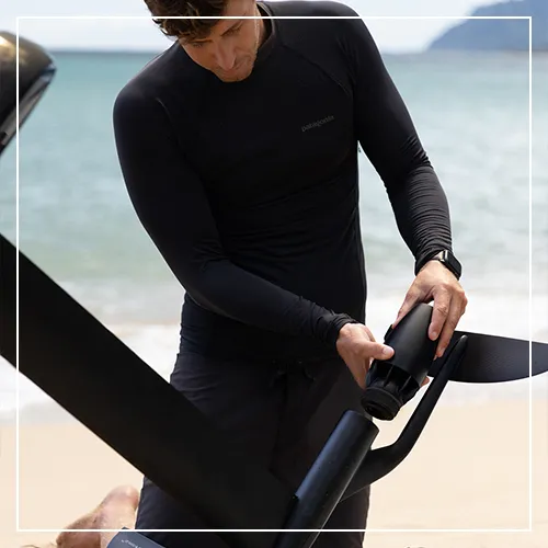Superyacht crew member assembling a Fliteboard