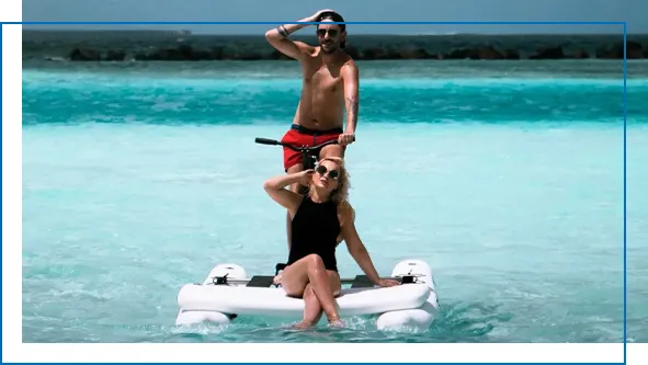 Schiller Bike with man and woman on blue ocean