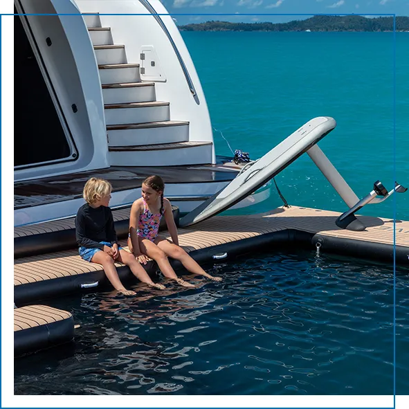 Child charter guests enjoying the FunAir pool on superyacht Impulsive