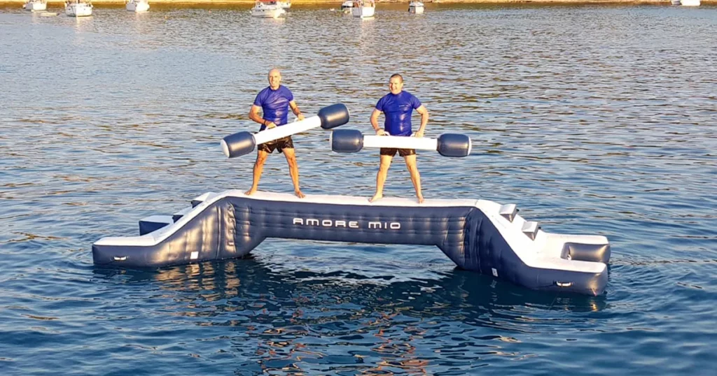 Superyacht crew from charter yacht MY Amore Mio on the FunAir Water Joust