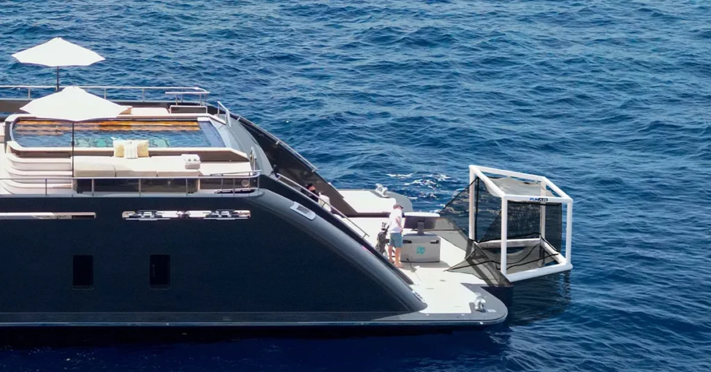 Side view of the FunAir Off the Deck Cube Golf Net on the rear of a charter superyacht
