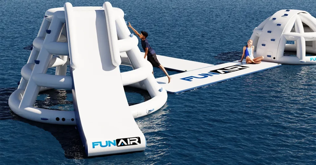 Young superyacht charter guest playing on the FunAir Splash Tower