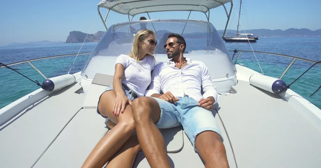 a couple relaxing on their charter yacht vacation