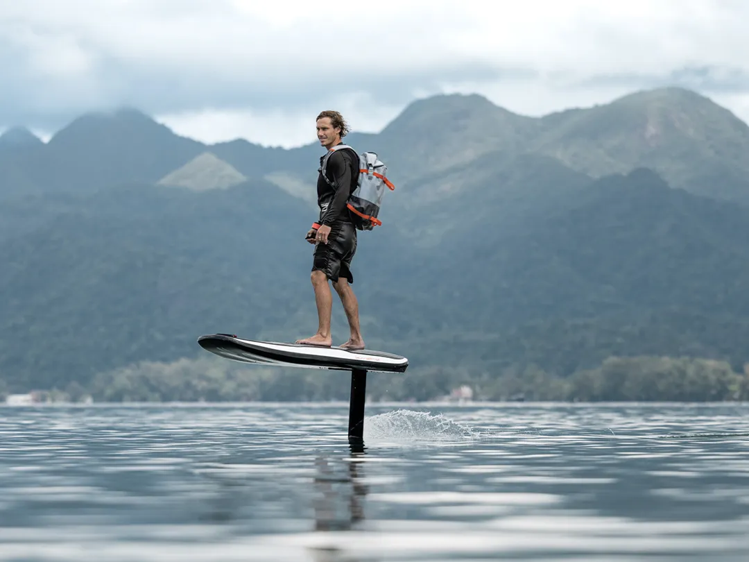 Superyacht crew member riding an Awake yacht toy