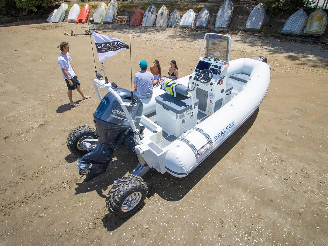 Superyacht crew on a beach with a Sealegs Luxury Tender