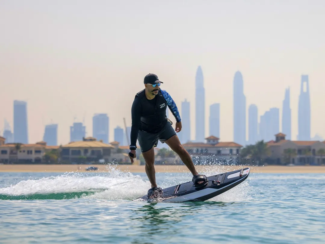 yacht crew riding an Awake board during a superyacht charter