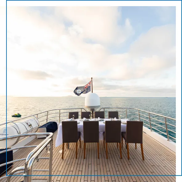 Al fresco dining on the flybridge of charter superyacht Phoenix One