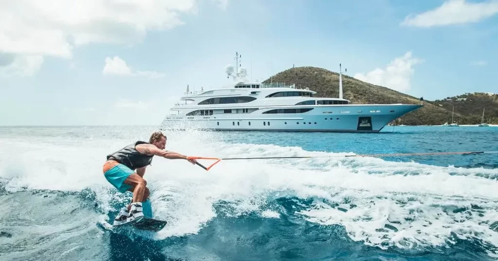 charter guest from a superyacht wakeboarding @camperandnicholsons